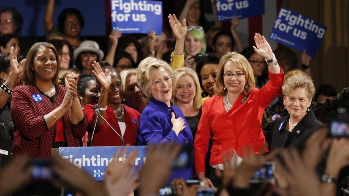 From left, Congresswoman Leticia James, New York City first lady Chirlane McCray, join and former Arizona congresswoman Gabrielle Giffords, second from right, join Democratic presidential candidate Hillary Clinton, center, at a Women for Hillary event at the New York Hilton hotel in midtown Manhattan one day ahead of the New York primary, Monday, April 18, 2016, in New York.