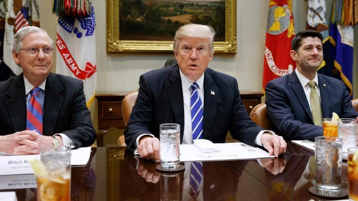 President Donald Trump, flanked by Senate Majority Leader Mitch McConnell, R-Ky., and House Speaker Paul Ryan, R-Wis., March 1, 2017, in the Roosevelt Room of the White House in Washington.