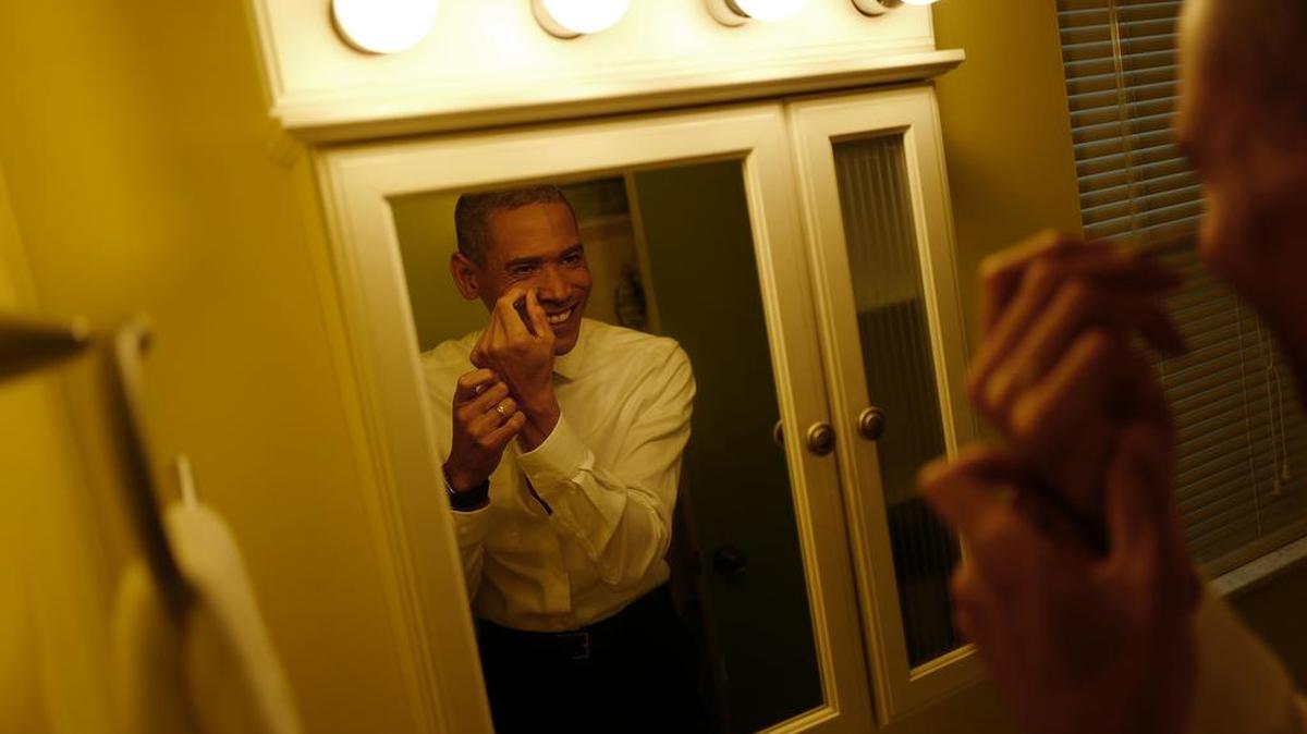 Obama impersonator Sean Banks NgYing gets ready to take part in his hometown Christmas parade on Dec. 5, 2015 in Deltona, Fla.