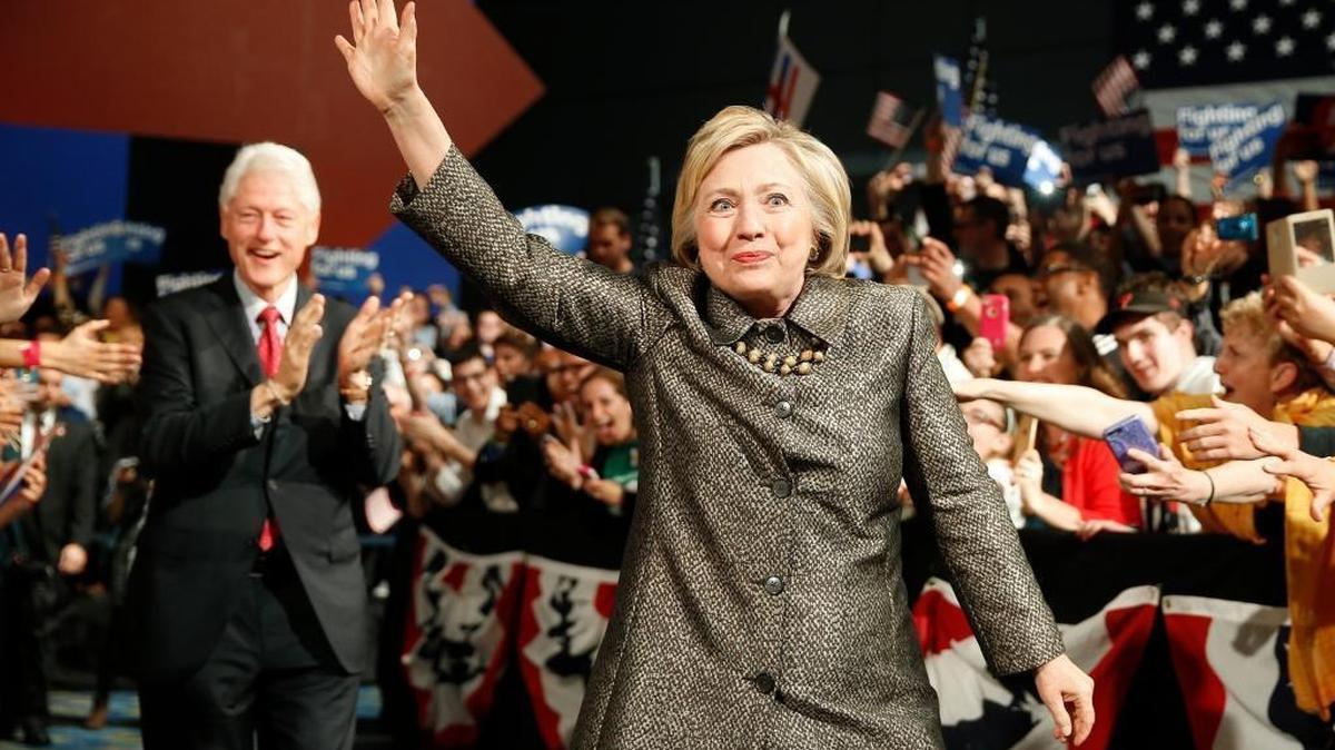 Democratic presidential candidate Hillary Clinton and former President Bill Clinton move to the stage at her presidential primary election night rally, April 26, 2016, in Philadelphia.