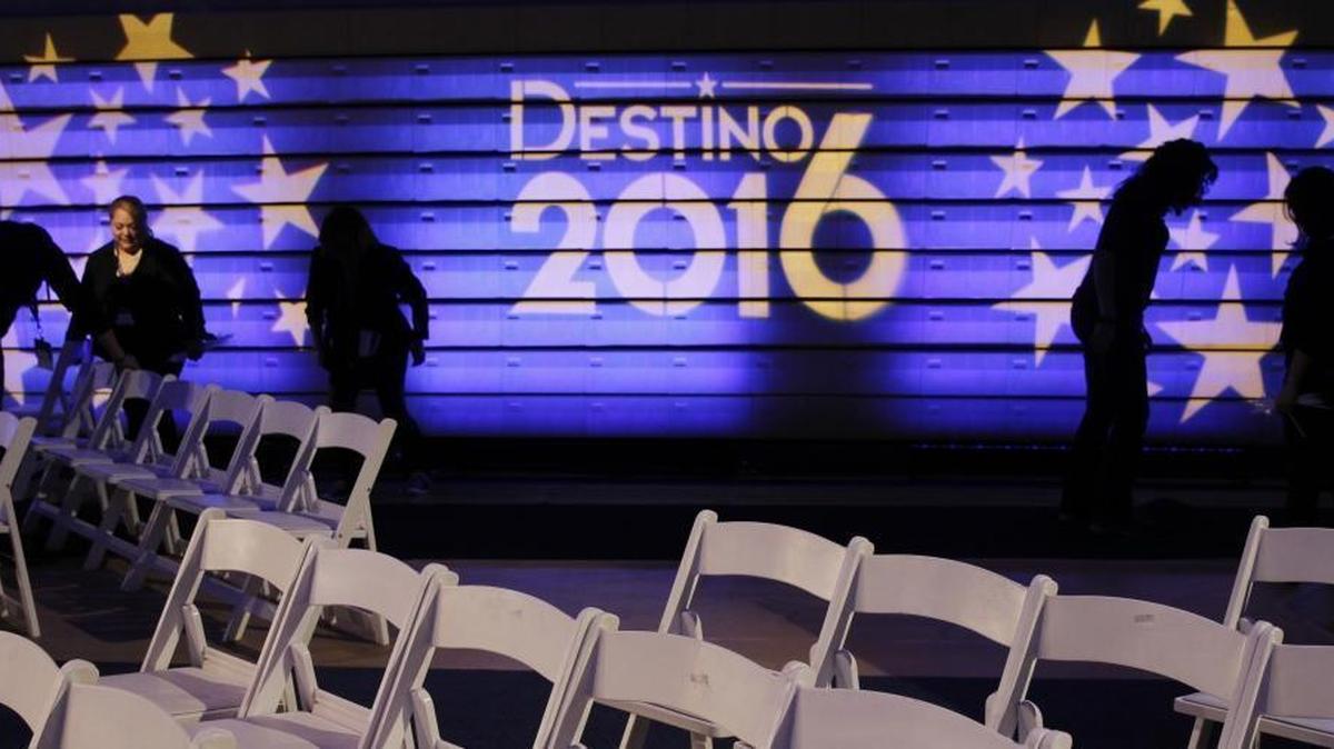 Miami Dade College staff work inside the hall where Democratic presidential candidates Hillary Clinton and Bernie Sanders will debate Wednesday, March 9, 2016, in Miami.