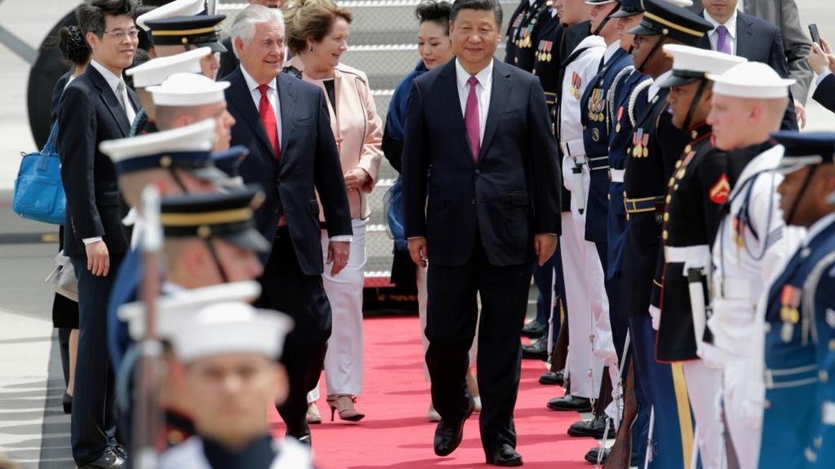 Secretary of State Rex Tillerson walks with Chinese President Xi Jinping at Palm Beach International Airport in West Palm Beach, Fla., Thursday, April 6, 2017. Xi was to meet with President Donald Trump later at Trump's Mar-a-Lago resort in Palm Beach.