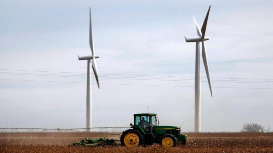 A farmer works in his fields near Roscoe, Texas. Roscoe is home to one of the largest wind farms in the world, and wind energy grew substantially during Gov. Rick Perry’s time in office.