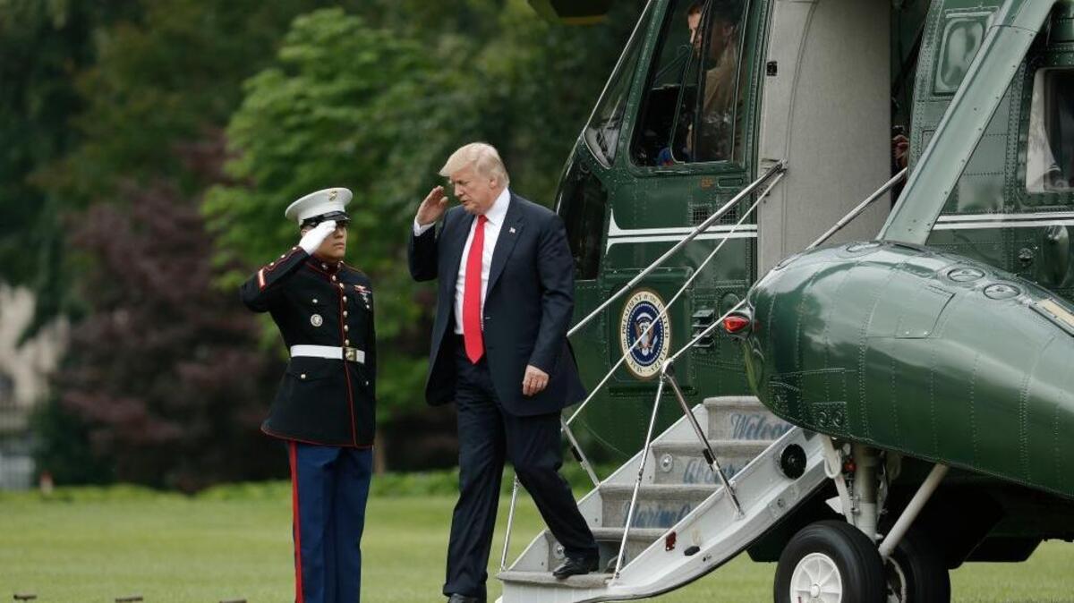 President Donald Trump returns a salute as he steps off Marine One helicopter during his arrival on the South Lawn of the White House in Washington, Wednesday, June 7, 2017. Trump was returning from Cincinnati, where he talking about overhauling aging infrastructure.
