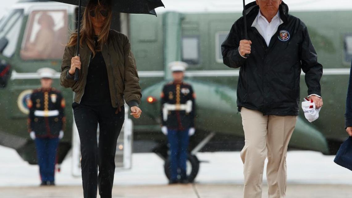 President Donald Trump and first lady Melania Trump walk from Marine One to board Air Force One at Andrews Air Force Base, Md., Tuesday for a trip to Texas to get an update on Hurricane Harvey relief efforts.