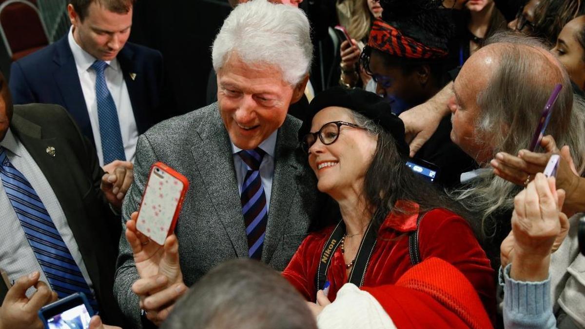 Former President Bill Clinton poses for photographs at the West End Community Development Center in Greenville, S.C., Tuesday, Feb. 16, 2016, during a campaign rally for his wife, Democratic presidential candidate Hillary Clinton.