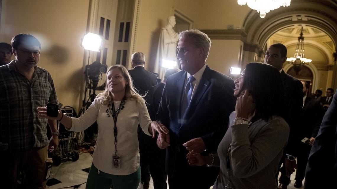 House Majority Leader Kevin McCarthy, R-Calif. (center), is taken to television interviews after walking out of the House Chamber on Capitol Hill in Washington, Thursday, May 4, 2017, after the Republican health care bill passed in the House.