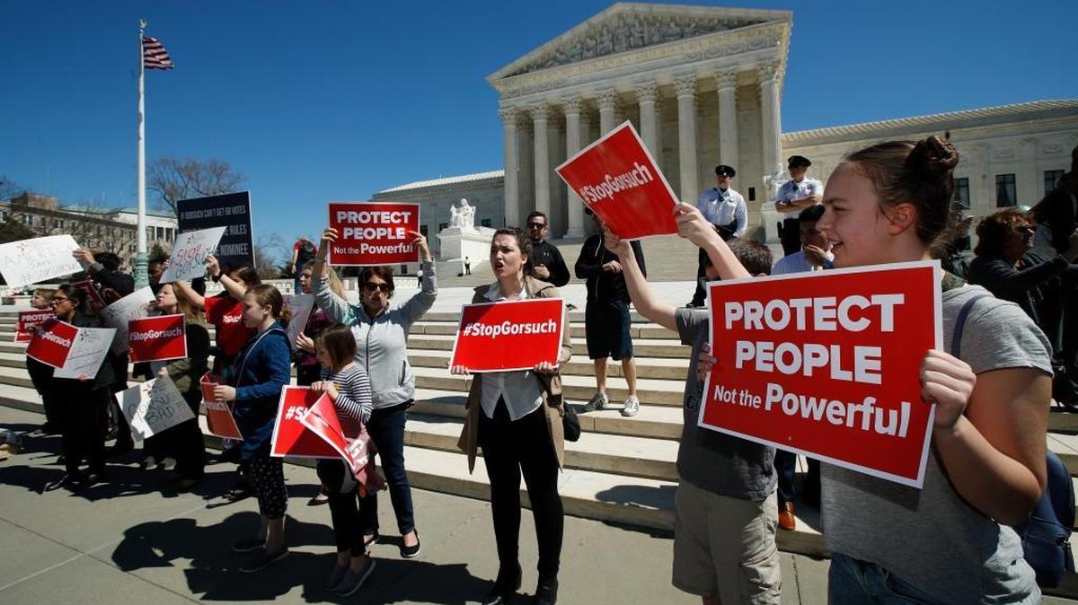 A group of protesters gather outside the Supreme Court in Washington.