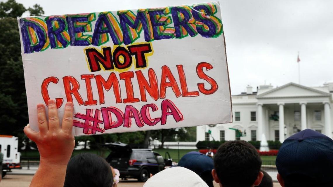 A woman holds up a sign in support of the Obama administration program known as Deferred Action for Childhood Arrivals, or DACA, during an immigration reform rally this month. The Trump administration could announce it is ending the program as early as Friday.