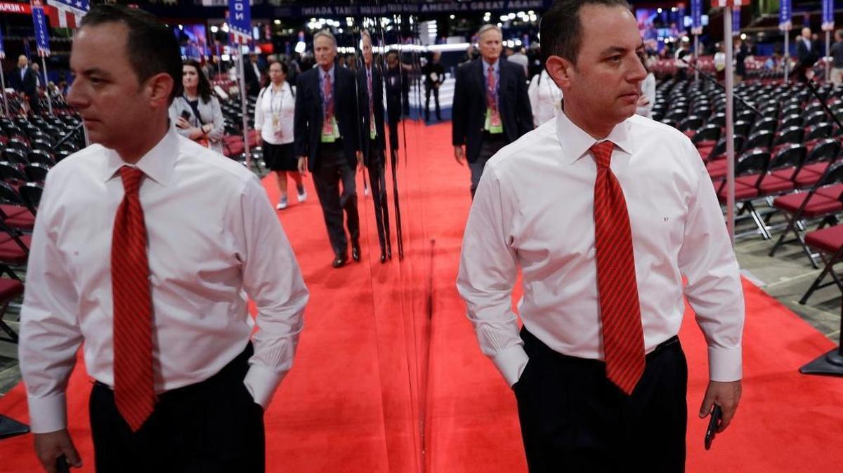 Reince Priebus, Chairman of the Republican National Committee, is reflected in a mirror as he walks the floor before the third day session of the Republican National Convention, Wednesday, July 20, 2016, in Cleveland. Some key organizations that keep tabs on the federal government and campaigns are complaining that they’ve been denied access to the Republican National Convention this week.