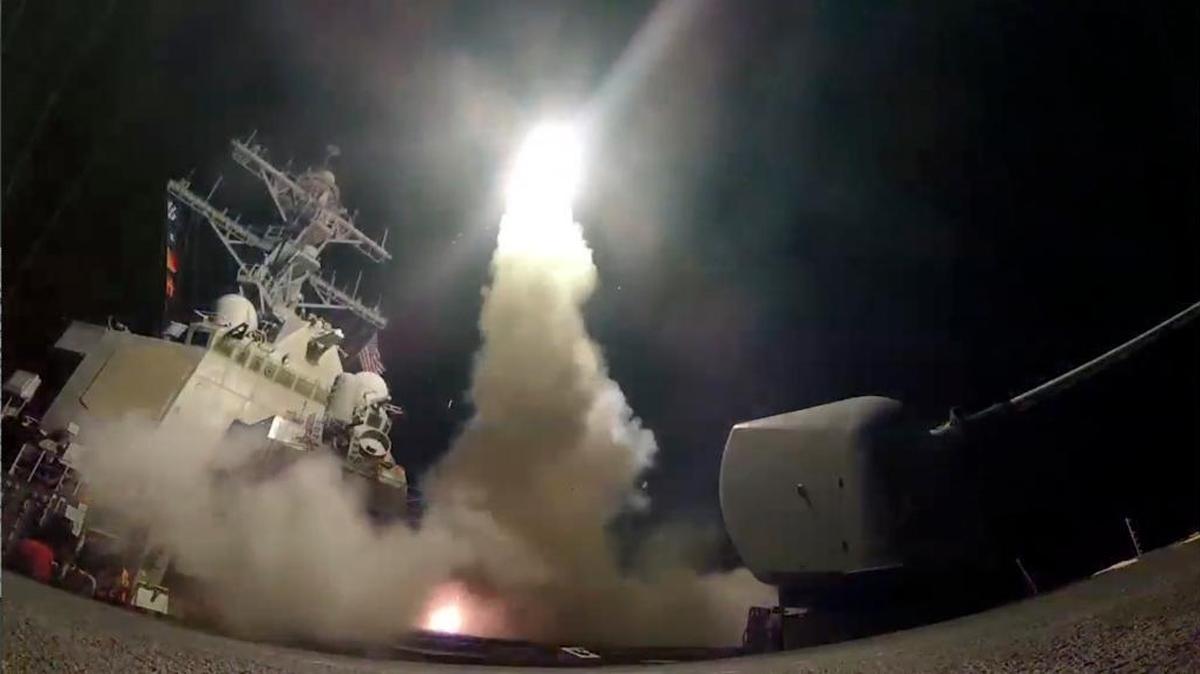 In this image from video provided by the U.S. Navy, the guided-missile destroyer USS Porter (DDG 78) launches a tomahawk land attack missile in the Mediterranean Sea, Friday, April 7, 2017.