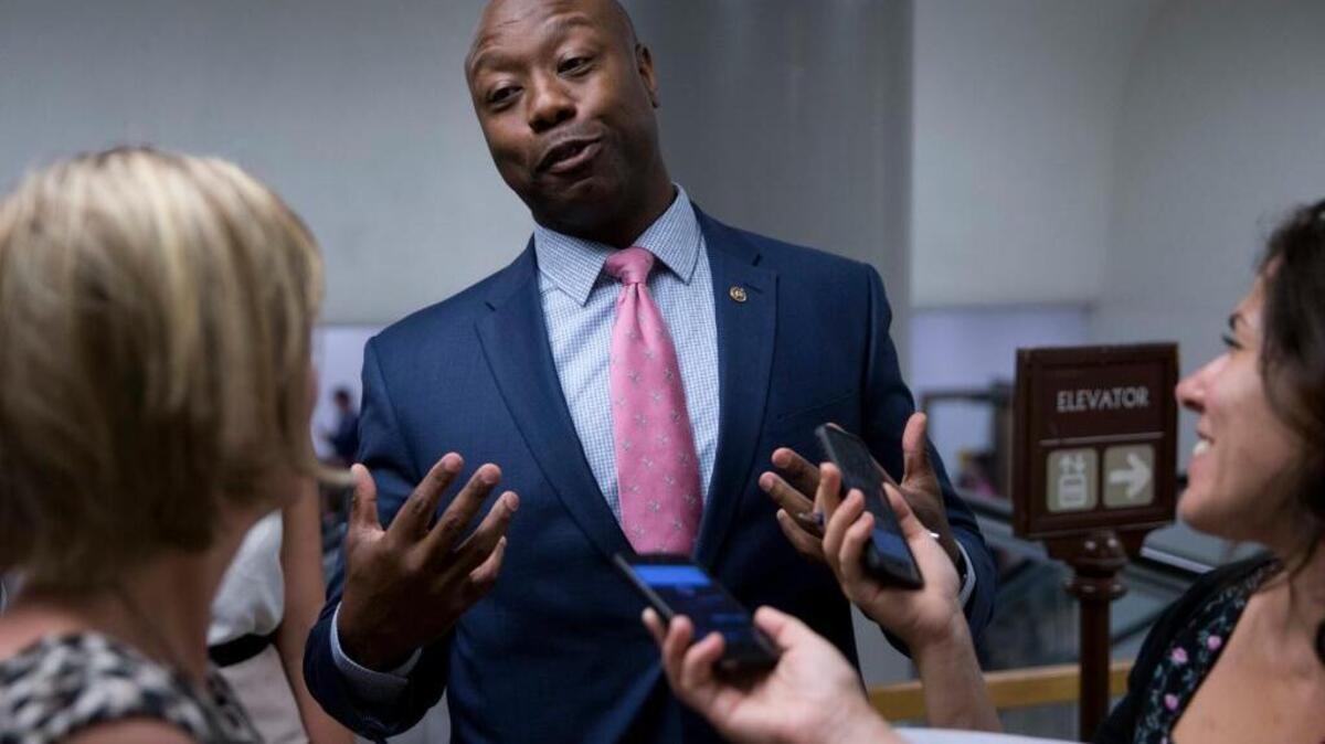 FILE - In this June 21, 2016, file photo, Sen. Tim Scott, R-S.C., talks with reporters on Capitol Hill in Washington. Scott, one of just two black members of the U.S. Senate and the only black Republican, said July 13 he has been repeatedly pulled over by law enforcement and was once even stopped by a Capitol Police officer who apparently did not believe he was a senator.
