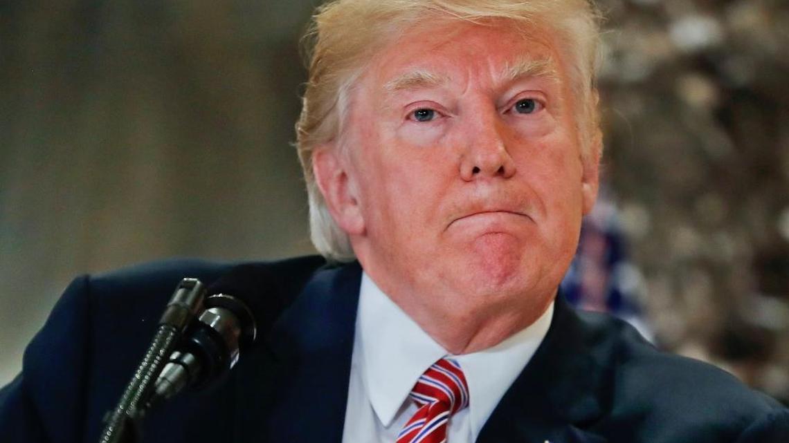 President Donald Trump pauses as he answers questions in the lobby of Trump Tower in New York, Tuesday, Aug. 15, 2017.