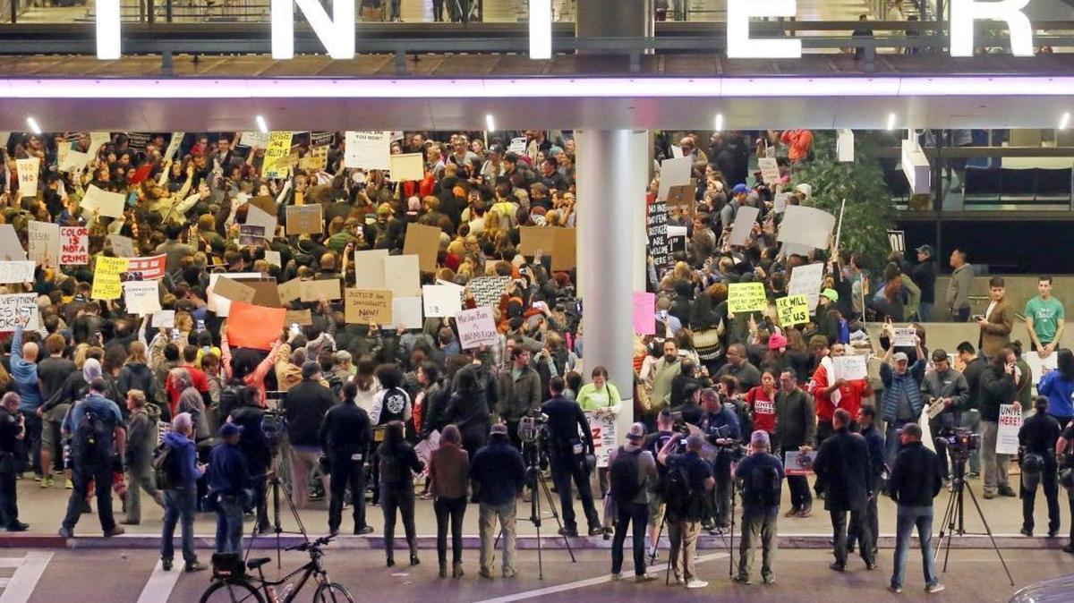 Hundreds of people opposed to President Donald Trump's executive orders barring entry to the U.S. of seven predominantly Muslim countries demonstrate at the Tom Bradley International Terminal at Los Angeles International Airport Saturday, Jan. 28, 2017.