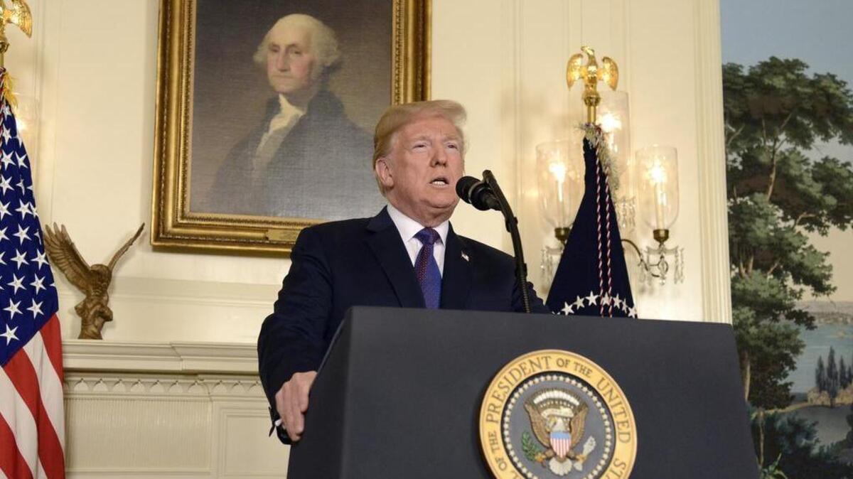 President Donald Trump speaks during a televised statement at the White House in Washington, D.C., on Friday night. Even as he promised to strike again if Bashar Assad used chemical weapons, Trump made clear that he had no interest in staying in Syria. Must credit: Bloomberg photo by Mike Theiler
