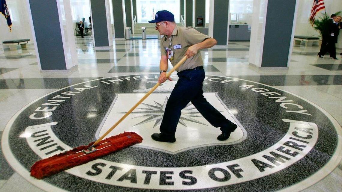 A worker slides a mop over the floor at the entrance to the Central Intelligence Agency in this 2005 file photo.