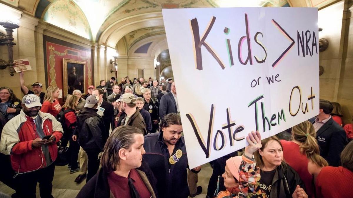 Advocates on both sides of the gun rights issue gather as two gun control measures are introduced at the Capitol, Thursday, March 1, 2018 in St. Paul, Minn. The issue of addressing gun violence is especially potent in moderate suburban districts.