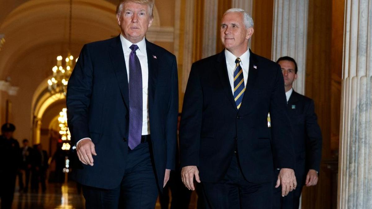 President Donald Trump and Vice President Mike Pence leave Capitol Hill after meeting with lawmakers on tax policy, Thursday, Nov. 16, 2017, in Washington. A pro-Trump group is urging the president’s supporters to activate on tax reform.
