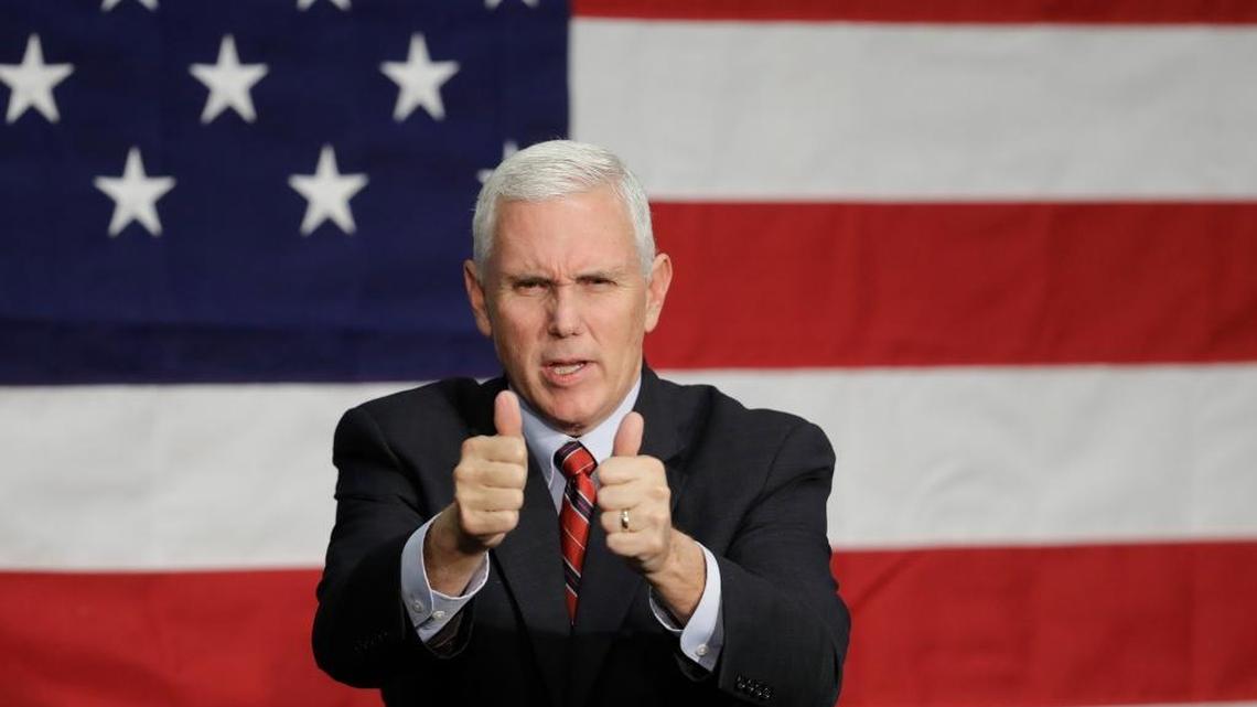 Republican vice presidential candidate, Indiana Gov. Mike Pence reacts following a campaign rally in Fort Wayne, Ind.