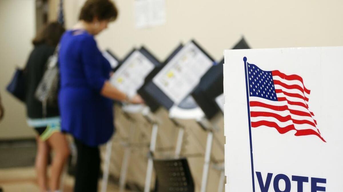 Voters cast their ballots during early voting Thursday in Sandy Springs, Ga. Russian officials have offered to monitor elections this year in Louisiana, Texas and Oklahoma – and were turned away.