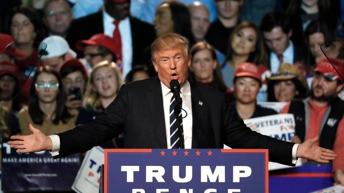 In this Election Day photo, Republican presidential candidate Donald Trump speaks at a campaign rally in Grand Rapids, Mich.