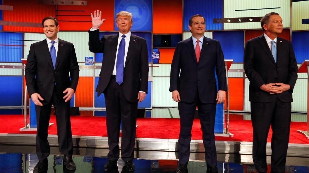 Republican presidential candidates Sen. Marco Rubio of Florida, businessman Donald Trump, Sen. Ted Cruz of Texas and Ohio Gov. John Kasich take the stage before a presidential primary debate at Fox Theatre, Thursday, March 3, 2016, in Detroit.