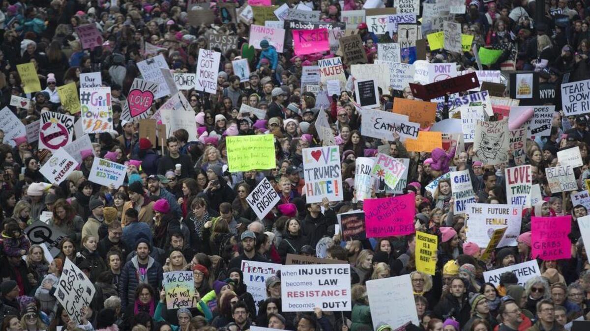 Demonstrators marched across 42nd Street during a women's march, Saturday, Jan. 21, 2017, in New York.