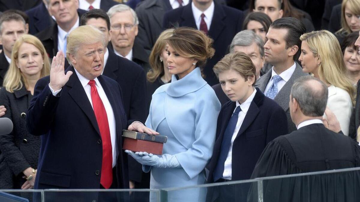 Chief Justice of the United States John Roberts administers the oath of office to President Donald Trump.