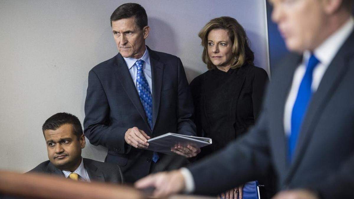 Former national security adviser Michael Flynn, center left, and K.T. McFarland, deputy national security adviser, center, listen as White House press secretary Sean Spicer speaks on Feb. 1, 2017.