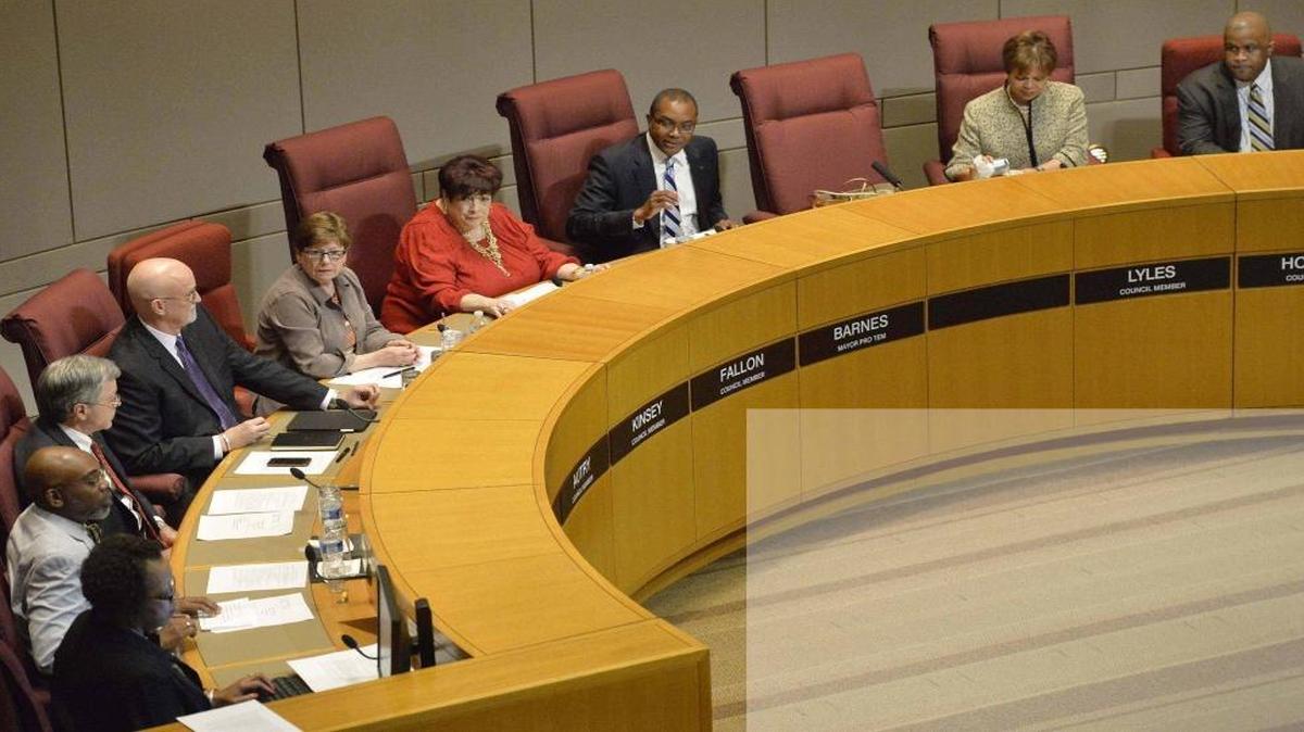 Former council member Michael Barnes (center) speaks during a City Council meeting.