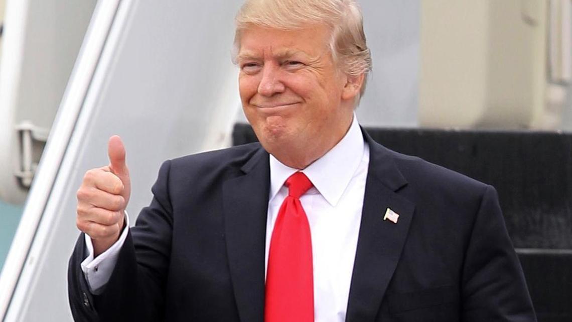 In this Friday, March 3, 2017, file photo, President Donald Trump walks down the stairs of Air Force One upon his arrival at Palm Beach International Airport in West Palm Beach, Fla.