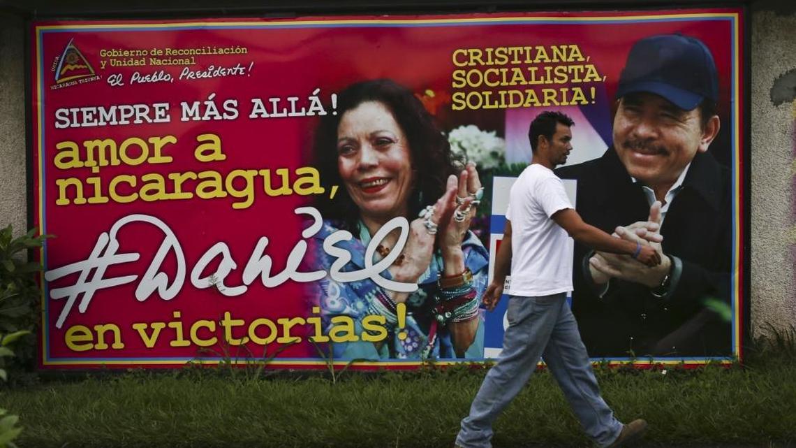A man walks past a billboard promoting Nicaragua's President Daniel Ortega and running mate, his wife Rosario Murillo, in Managua, Nicaragua, Saturday, Nov. 5, 2016.