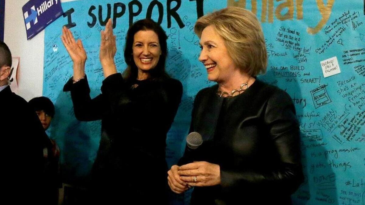 Democratic presidential candidate Hillary Clinton, right, smiles next to Oakland Mayor Libby Schaaf at Clinton's campaign field office in Oakland, Calif., Friday, May 6, 2016.
