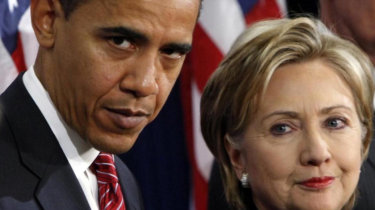 In this Dec. 1, 2008, photo, then-President-elect Barack Obama, left, stands with then-Sen. Hillary Rodham Clinton, D-N.Y., after announcing that she is his choice as Secretary of State . President Barack Obama and Hillary Clinton campaign together in Charlotte, which says a lot about how her campaign views her path to replace him in the White House.