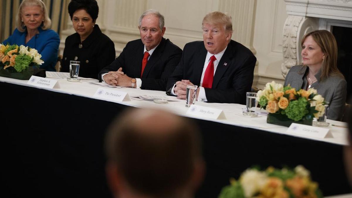 President Donald Trump speaks during a meeting with business leaders in the State Dining Room of the White House in Washington on Friday. From left are, IBM CEO Ginni Rometti, PepsiCo CEO Indra Nooyi, Blackstone CEO Stephen Schwarzman, Trump, and GM CEO Mary Barra.