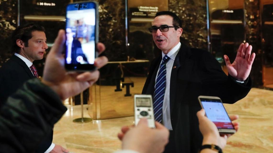 Steven Mnuchin, national finance chairman of President-elect Donald Trump's campaign, waves after speaking to media at Trump Tower, Wednesday, Nov. 16, 2016, in New York.