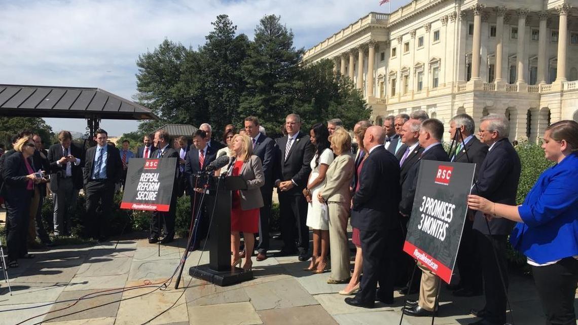 Rep. Diane Black of Tennessee speaks to reporters at a Republican Study Committee press conference on Tuesday, Sept. 26, 2017. Rep. Mark Walker, R-N.C., is standing behind her wearing a purple tie.