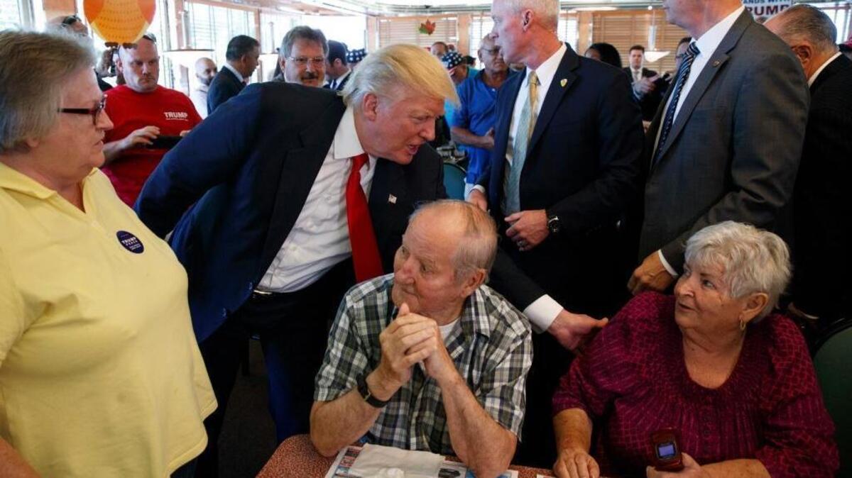 Republican presidential candidate Donald Trump meets with patrons during a visit to the Boulevard Diner on Monday, Sept. 12, 2016, in Dundalk, Md.