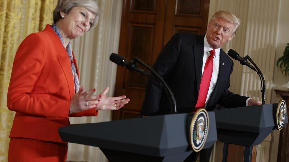President Donald Trump speaks during a news conference with British Prime Minister Theresa May in the East Room of the White House in Washington.