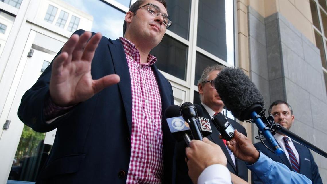 Virginia delegate to the Republican National Convention Carroll Correll Jr., left, talks with the media after a hearing on his lawsuit at federal court in Richmond, Va. Correll wants to avoid voting for presumptive nominee Donald Trump at the party convention.