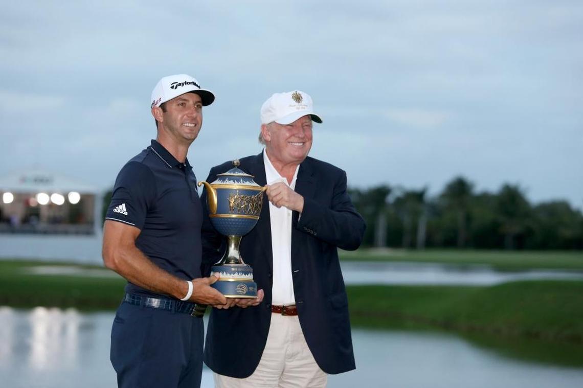 Dustin Johnson and Donald Trump pose with the winners trophy on March 8, 2015, after the final round of the WGC - Cadillac Championship golf tournament, hosted by Trump at the Blue Monster course at his Doral, Fla., resort. The PGA has since found another venue for the tournament.