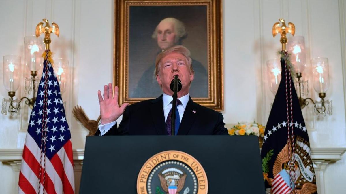 President Donald Trump speaks in the Diplomatic Reception Room of the White House on Friday, April 13, 2018, in Washington, about the United States' military response to Syria's chemical weapon attack on April 7.