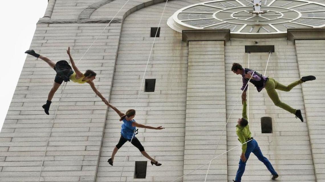 Aerial dancers with Project Bandaloop rehearse on the architecture of the Old Post Office Pavilion, home to the National Endowment for the Arts, in Washington, May 9, 2012.
