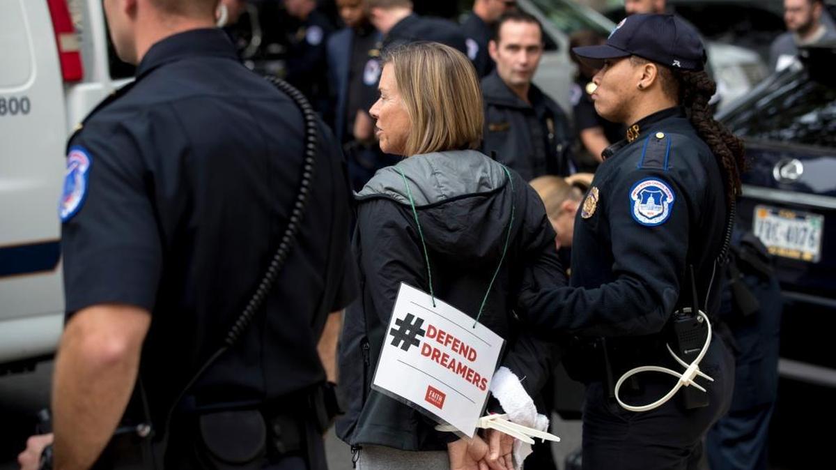 A group of religious leaders from across the country are arrested after protesting in support of the Dream Act on Capitol Hill Wednesday.