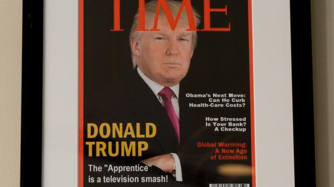 Framed portrait of President Donald Trump on what looks like a cover of a TIME Magazine is hanging from a wall at the Trump National Doral Miami Golf Shop. The cover is fake.