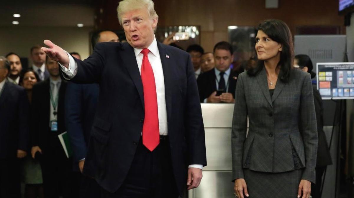 President Donald Trump, accompanied by U.S. Ambassador Nikki Haley, arrives at the United Nations Monday.