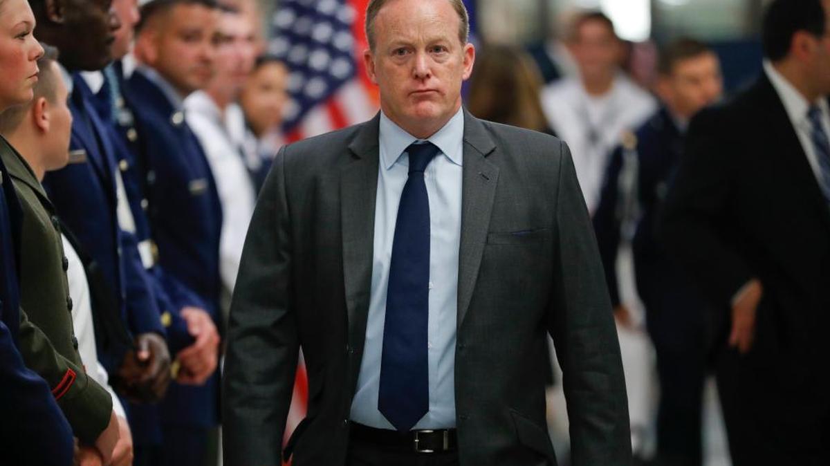 White House press secretary Sean Spicer walks down the hallway during President Donald Trump's visit to the Pentagon, Thursday. Spicer has resigned over hiring of new communications aide.