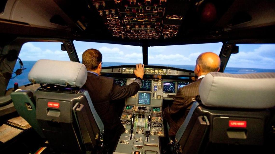 Jet Blue pilot, Captain Joe Devito, left, navigates a NextGen flight simulator with FAA Administrator Michael Huerta at a Jet Blue facility in Orlando, Fla on Sept. 20, 2012. President Trump and many lawmakers want to privatize parts of the FAA, in part because of the agency’s delays in implementing the NextGen system, which uses GPS and other high-tech systems to manage air traffic control.