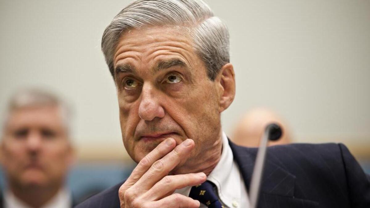 FBI Director Robert Mueller listens as he testifies on Capitol Hill in Washington, Thursday, June 13, 2013.