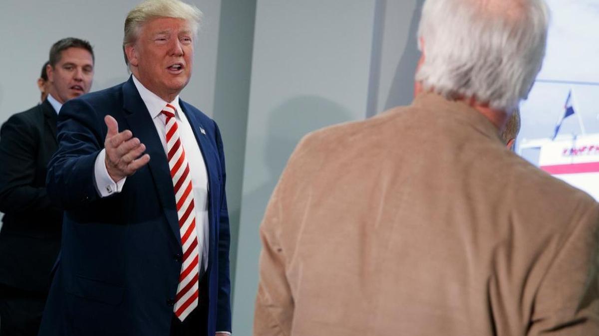 Republican presidential candidate Donald Trump arrives for a roundtable meeting with energy executives, Tuesday, Oct. 4, 2016, in Denver.